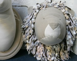 The lion's mane is beautiful mess of various neutral toned yarn. 