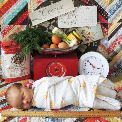 George's stats: Name, birth date (on the calendar), Gemini, weight (5lb. sack of flour plus 2 lbs. 14 oz. on the scale), time, and length (the ruler).  