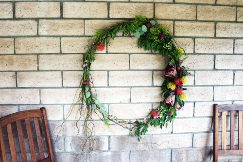 I made one giant floral and grapevine wreath to anchor the back wall of the outdoor space. 