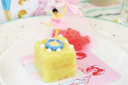 Lemon petit four with vintage plastic ballerina.