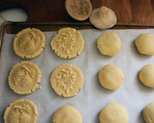 I lightly squashed the larger balls into disks before pressing to help with the edges cracking too much. 