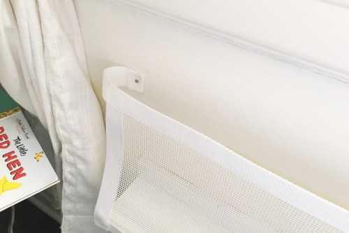 Use the velcro to stick the bottom edge of the mesh onto the front of the shelf and then turn in the long ends and secure to the wall. I used small nails because we live in a rental, but you could use a screw or do something more decorative. 