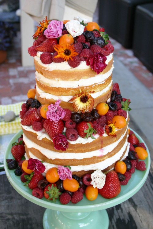 The dessert!  A naked buttermilk cake with stabilized whipped cream. berries, kumquats and edible flowers.  