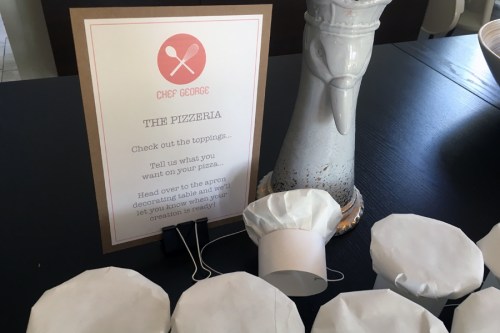 When guests entered, they gave their pizza order to me or my mom and then headed outside.   I made tiny party sized chef hats out of butcher paper and copy paper! 