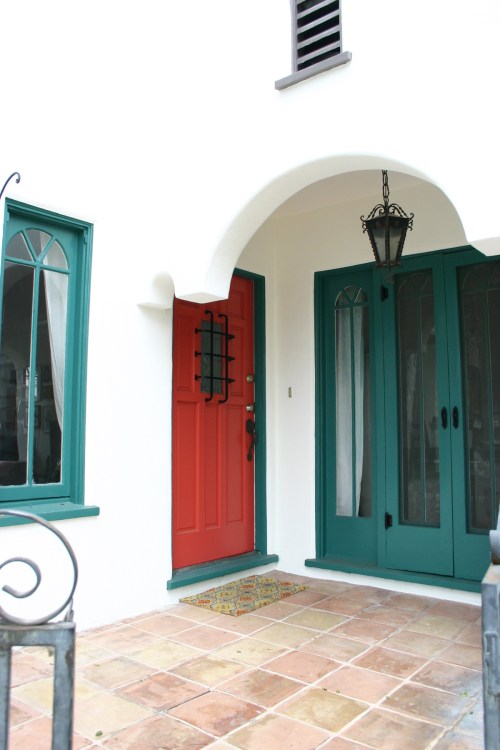 Functional French doors with new hardware and a cheerful tomato red front door! 